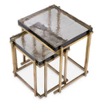 Eichholtz Side Table Niemeyer set of 2 brass finish and thick, handcrafted glass tabletops. Each piece of glass is unique and individually