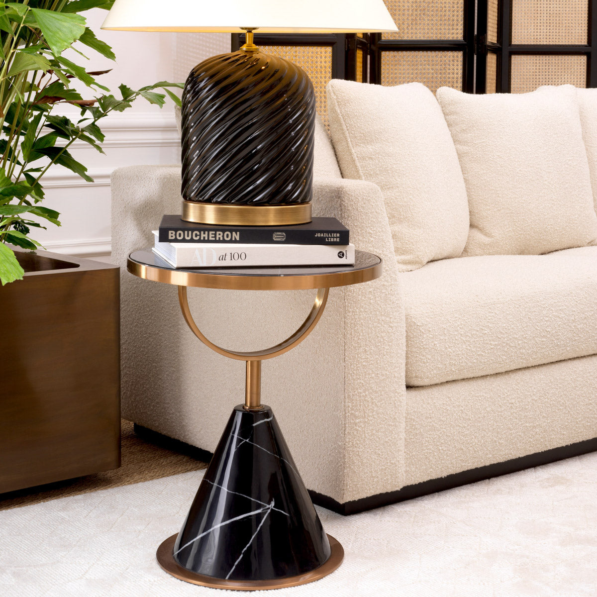 Eichholtz Side Table Park Lane a round tabletop and conical base of faux black marble, it has a modern structure