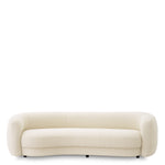 Eichholtz Sofa Blaine a lush Bouclé ivory upholstery and black feet. Sofa Blaine Crafted by Eichholtz this sofa