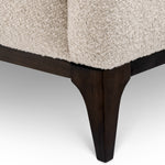 Eichholtz Sofa Brannan sophisticated charm. The contrasting black base adds a sleek touch, making it a striking centerpiece