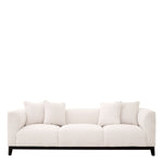 Eichholtz Sofa Corso Lyssa off-white upholstery and mounted on a sleek black finish frame. Thick foam cushioning provides