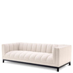 Eichholtz Sofa Ditmar Resting upon a black finish base and upholstered in cream-coloured bouclé, Sofa Ditmar will bring