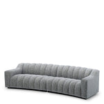 Eichholtz Sofa Kelly L "Striking blue upholstery complements the fluid contours of Sofa Kelly L Montclair blue, creating a