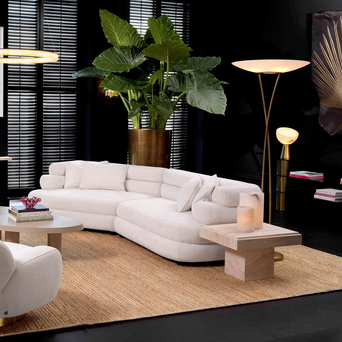 Eichholtz Sofa Malaga L has four scatter cushions and a unique form that makes it incredibly comfortable and easy