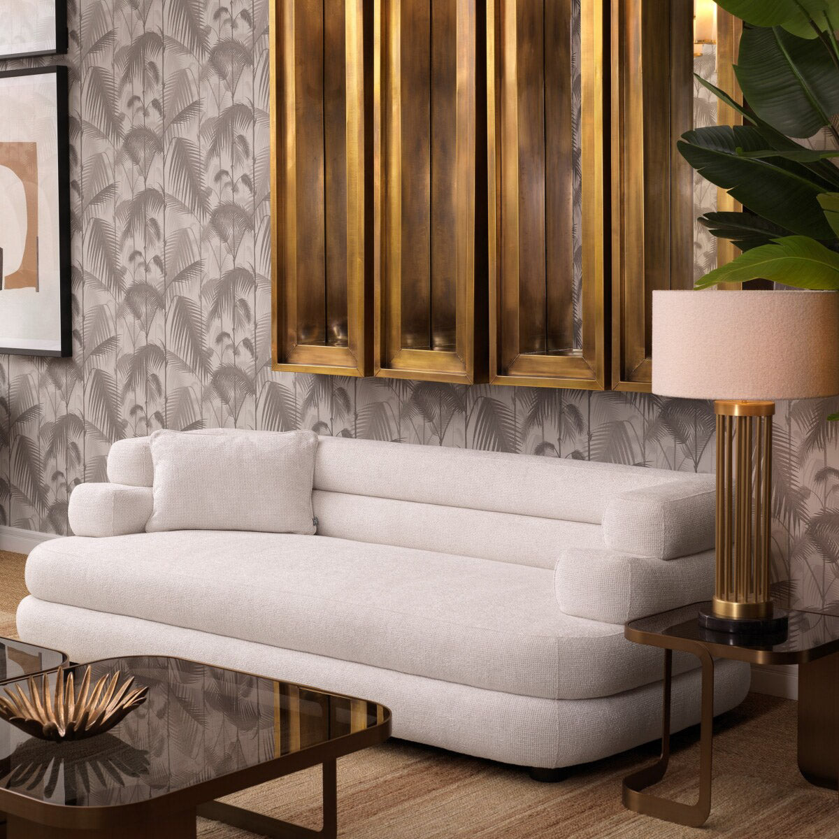 Eichholtz Sofa Malaga S has four scatter cushions and a unique form that makes it incredibly comfortable and easy