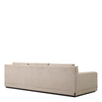 Eichholtz Sofa Manhattan Upholstered in sumptuous Palmer Beige fabric with a sleek black base, it harmonizes beautifully with