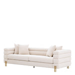 Eichholtz Sofa York The fabulous bouclé cream York Sofa with brushed brass legs oozes a touch of decadence.
