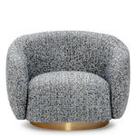 Eichholtz Swivel Chair Brice living space. Soft, sculptural, and stylish, this swivel chair in blue fabric offers both comfort