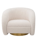Eichholtz Swivel Chair Cristo fabric with a round brushed brass swivel base. The impressive styling of this graceful recliner