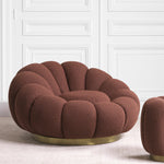 Eichholtz Swivel Chair Mello your home. Looking like an open flower, this delightful accent chair with Bouclé rouge upholstery