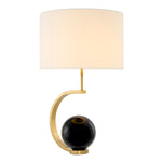 Eichholtz Table Lamp Luigi Table Lamp. This charming design features a gold finish and showcases a black marble ball