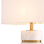 Eichholtz Table Lamp Newall linen mix shade, create a warm and inviting glow. The Newall table lamp, an iconic
