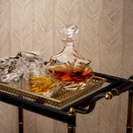 Eichholtz Trolley Princess brass finish and black leather, this trolley exudes an air of timeless elegance. The clear