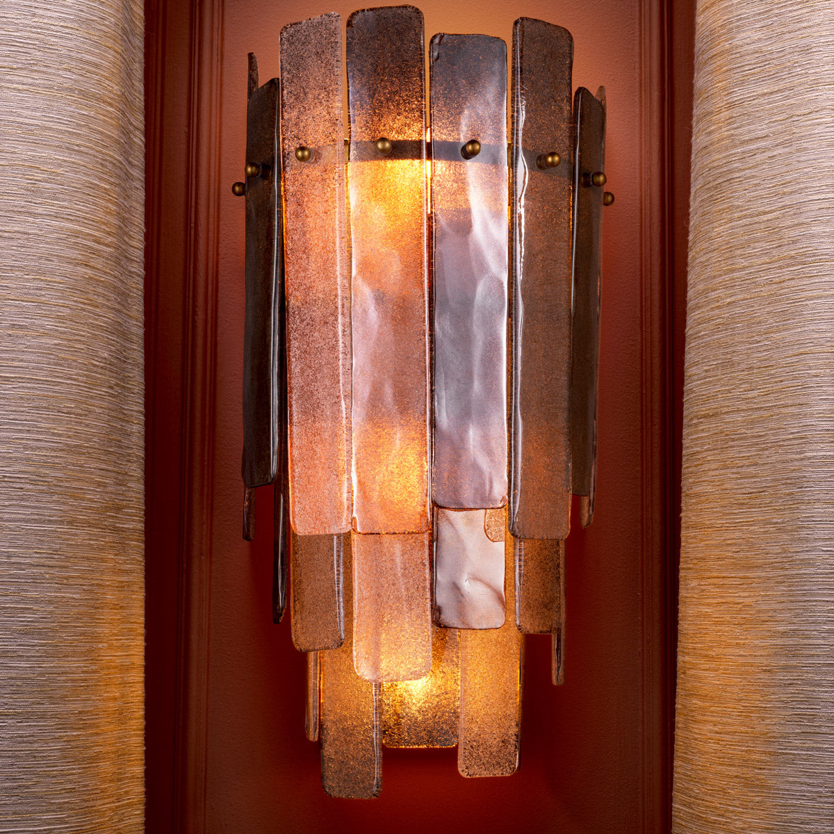 Eichholtz Wall Lamp Greyson and luxury intertwine to elevate your decor. Each lamp features handmade glass in varying color