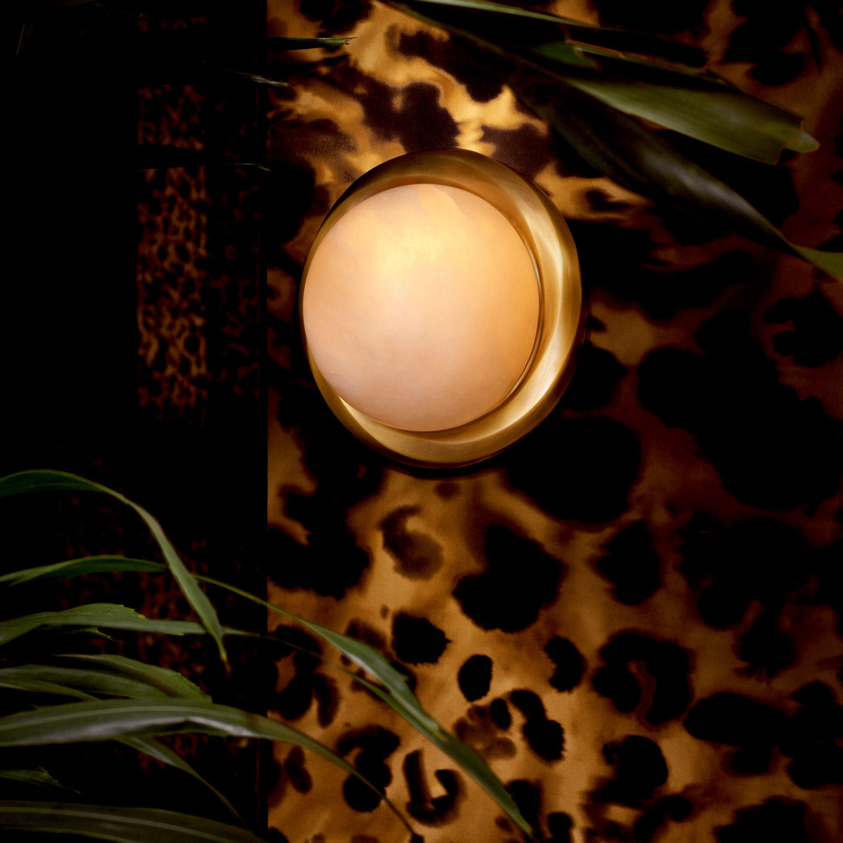 Eichholtz Wall Lamp Vigo lamp is crafted from alabaster with an antique brass finish, offering a blend of elegance
