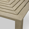 An outdoor dining table in aged teak set on a terrace — Eichholtz Vistamar collection