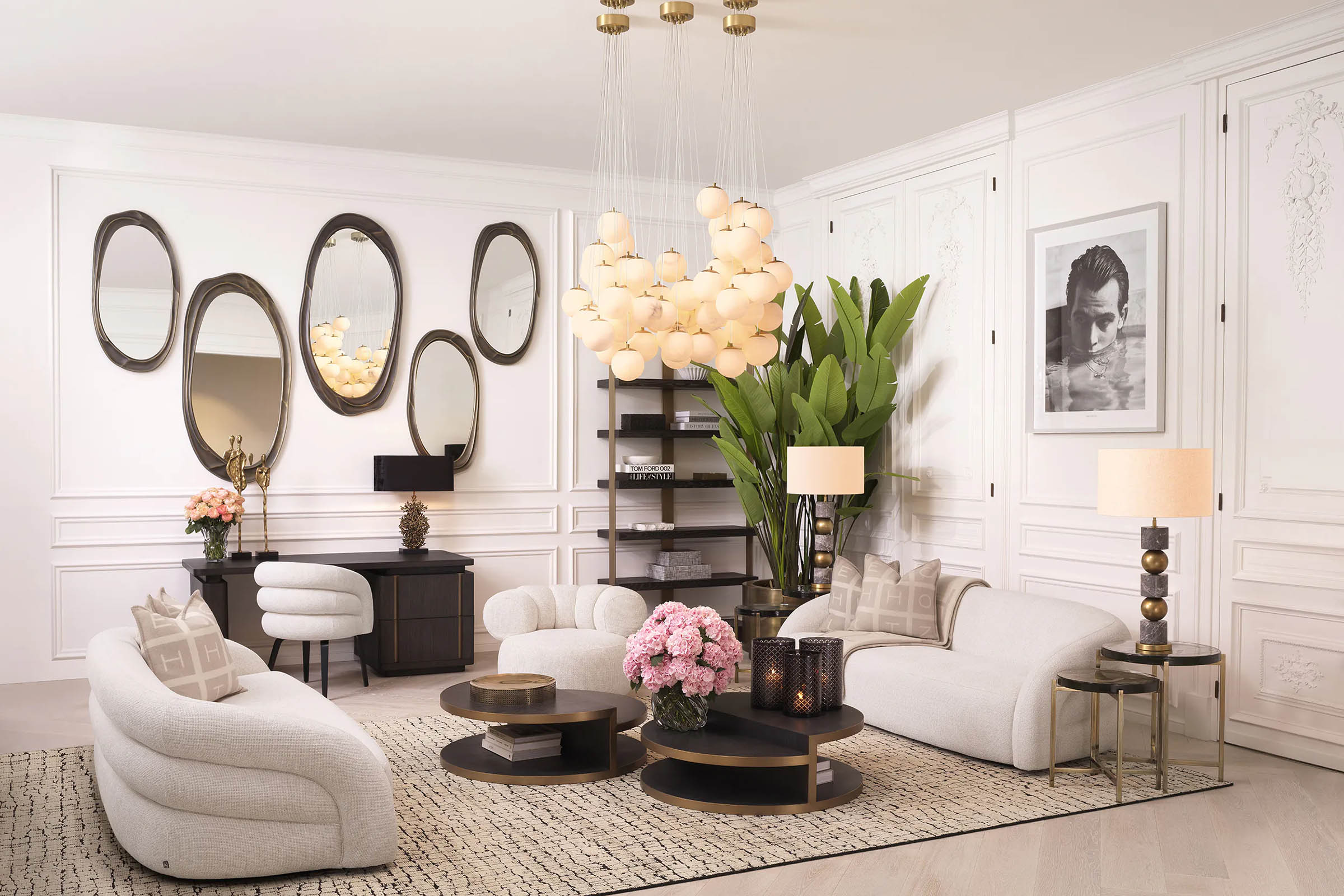 Gallery wall of oval mirrors in a white luxury living room — Eichholtz Las Vegas