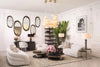 Gallery wall of oval mirrors in a white luxury living room — Eichholtz Las Vegas