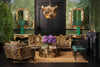Two Eichholtz console tables with ornate gold mirrors and emerald table lamps — a console-mirror-lamp vignette composition