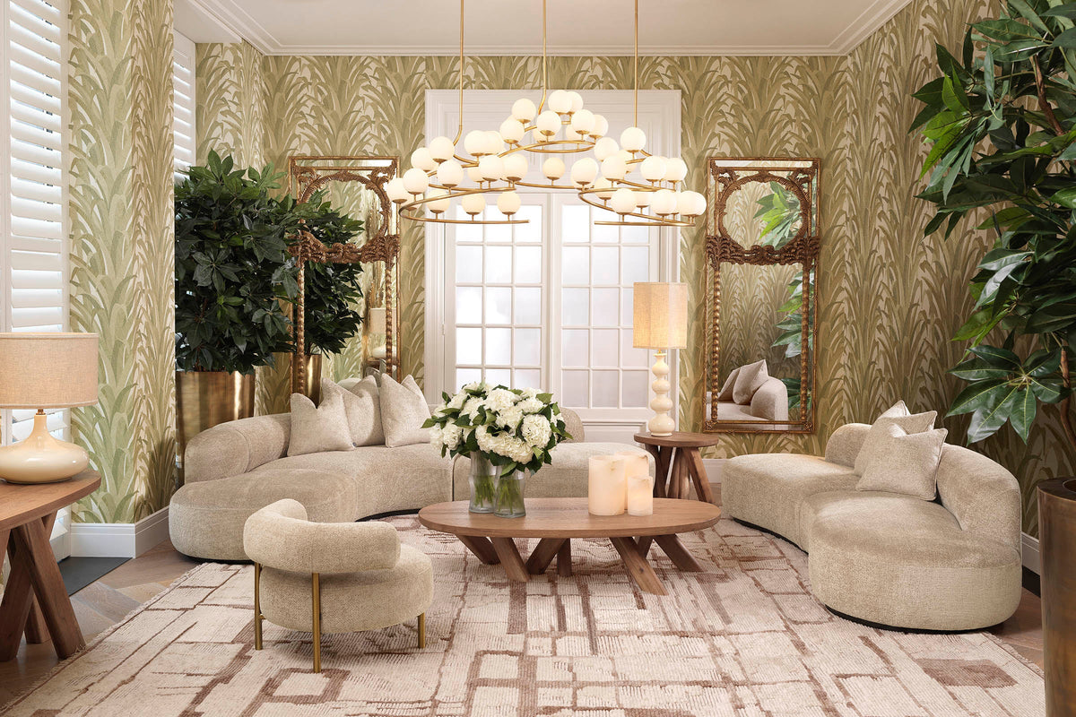 A curated Eichholtz interior — layered seating, brass accents, and a carefully composed principal wall