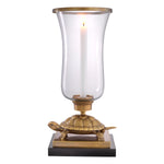 Eichholtz Hurricane Tortoise vintage brass finish Classic with a twist, the Tortoise Hurricane Candle Holder brings inspired style to your living spac