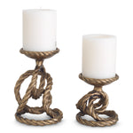 Candle Holder Corwyn set of 2 by Eichholtz in a styled setting — Antique Brass, Handcasted (Image 4)