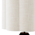 Lifestyle angle of Table Lamp Dionne with refined Piano Black, White Shade tones (Image 8)