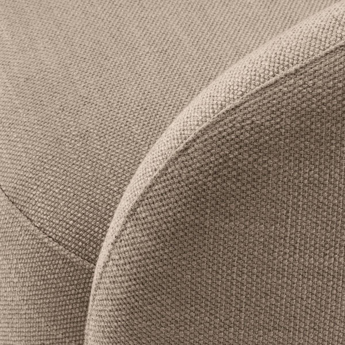 Lifestyle angle of Swivel Chair Brice with refined Avalon Sand, Brushed Brass Swivel Base tones (Image 8)