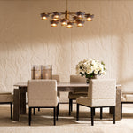 Lifestyle angle of Dining Chair Bromley with arm with refined Black, Arden Natural tones (Image 8)