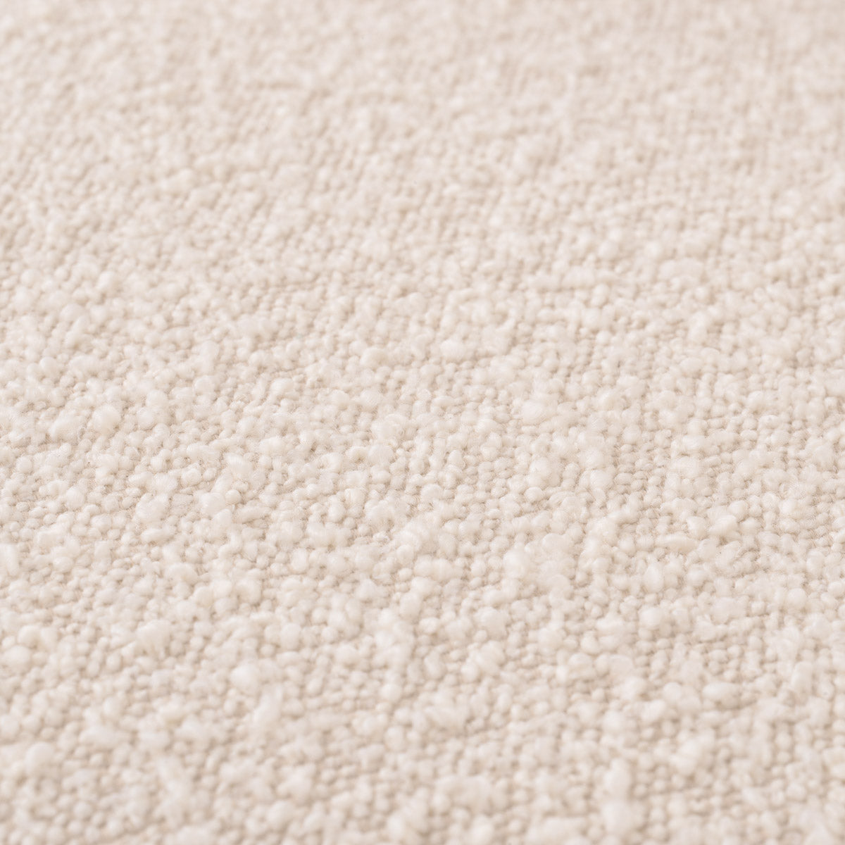 Close-up of Sofa Kelly XS highlighting Polyester, Acrylic and Bouclé Cream, Black Base (Image 2)