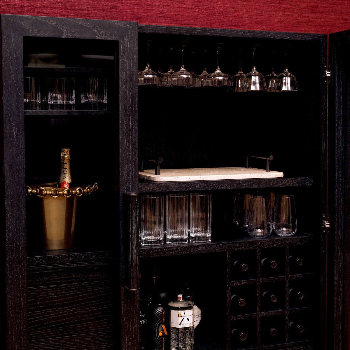 Eichholtz Bar Cabinet Connaught and accented by a luxurious bronze finish, this piece exudes elegance. With two clear glass