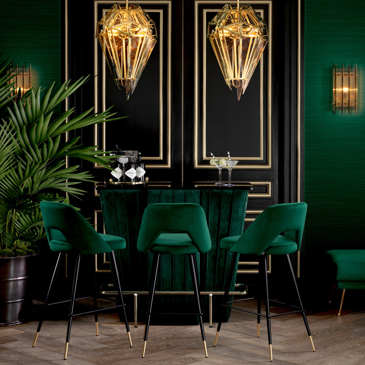 Eichholtz Bar Stool Avorio green velvet upholstered seat with button back and black tapered legs with brass caps, this
