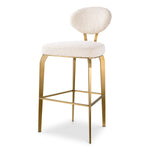 Eichholtz Bar Stool Dorrego The luxurious Bar Stool Dorrego is a masterpiece of elegance. Adorned in sumptuous Bouclé Cream,