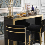 Eichholtz Bar Stool Scott the luxury Scott Barstool. Its gold finished frame with footrest adds glamour and sophistication to