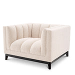 Eichholtz Chair Ditmar Resting upon a black finish base and upholstered in cream-coloured bouclé, Chair Ditmar will bring