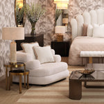 Eichholtz Chair Malaga classic Lyssa off-white covers a generously scaled, modern silhouette that feels totally high-end. Black feet