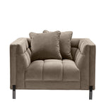 Eichholtz Chair Sienna whole with the armrests. This elegant modern armchair comes in a tufted upholstery in mellow
