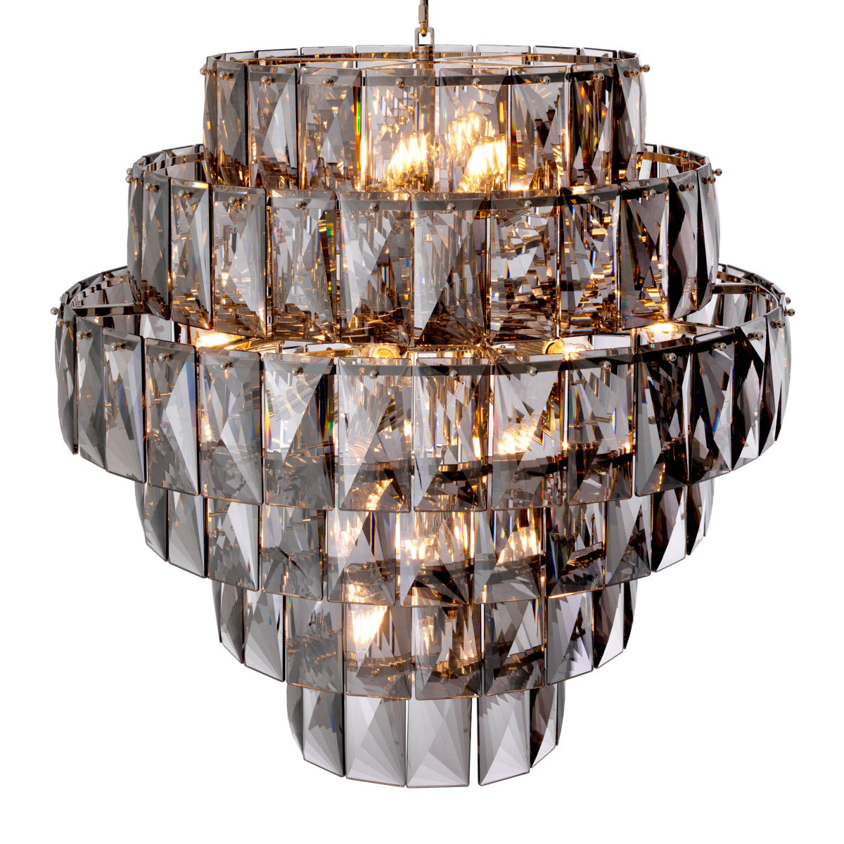 Eichholtz Chandelier Amazone L hang from different tiers, capturing and refracting light to create dramatic patterns on surrounding surfa...