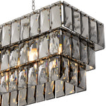 Eichholtz Chandelier Amazone rectangular features a 3-layered nickel finish frame filled with rectangular smoke crystals that capture and...