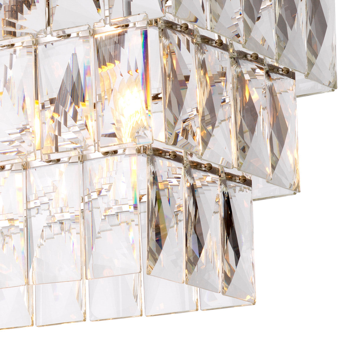 Eichholtz Chandelier Amazone rectangular features a 3-layered nickel finish frame filled with rectangular crystals that capture and refra...