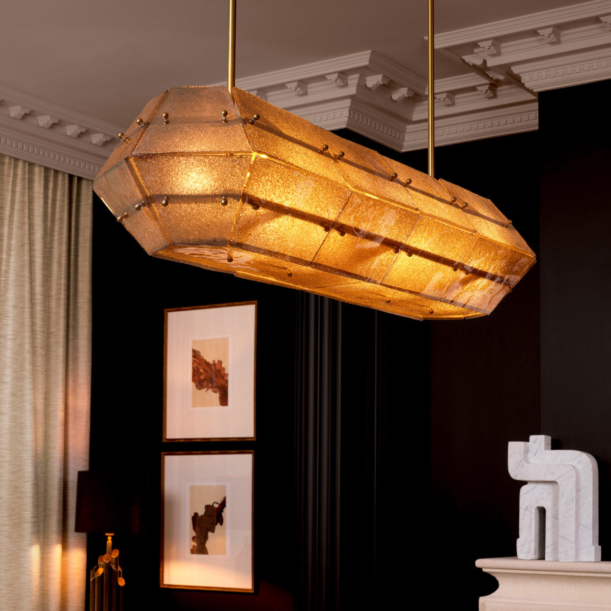Eichholtz Chandelier Ferrucci panels with an antique brass finish cast a warm, ambient glow, embodying the brand's commitment