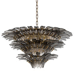 Eichholtz Chandelier Italo with overlapping decorations of ribbed smoked glass remind one of leaves and give the impression