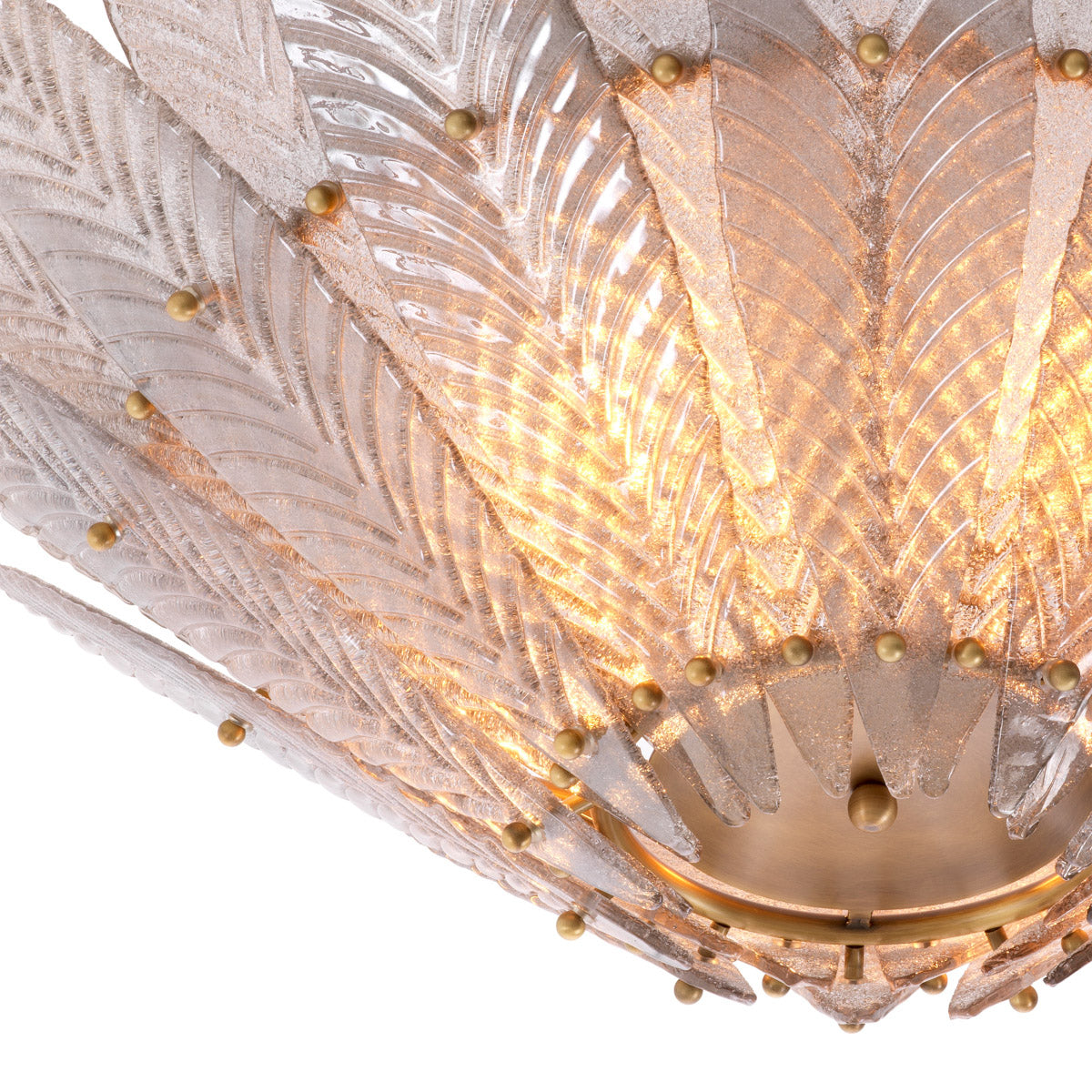 Eichholtz Chandelier Scala is made up of â€˜flower petals' of translucent handmade glass. Each petal features an engraved