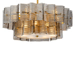 Eichholtz Chandelier Silvano Illuminate your space with the Chandelier Silvano, where smoke glass meets an antique brass finish,