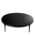 Eichholtz Coffee Table Artemisa L accents embellish the tapered feet. A circular beveled glass top ensures a high level of