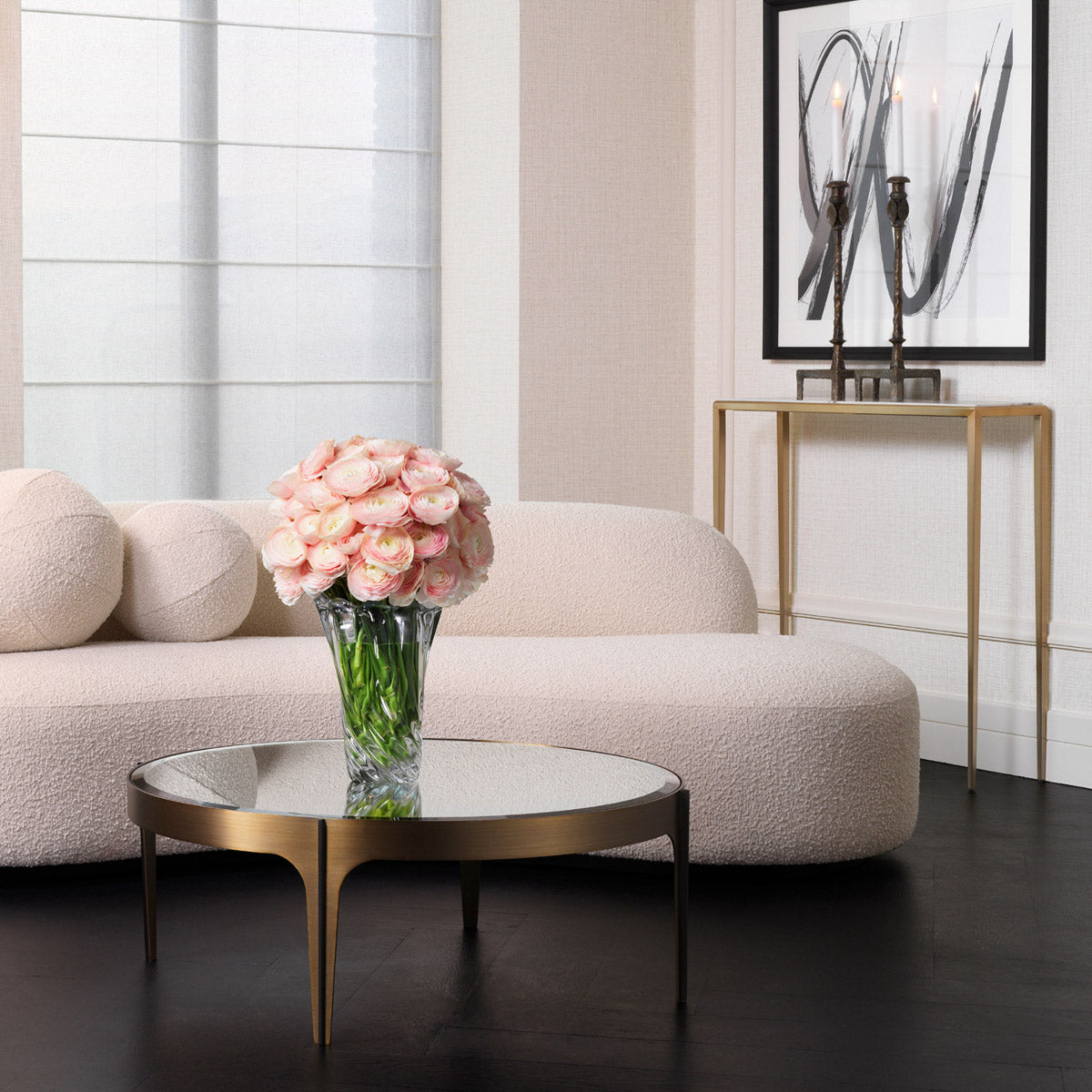 Eichholtz Coffee Table Artemisa S statement with an elegant metal frame in a brushed brass finish. The interior curves of