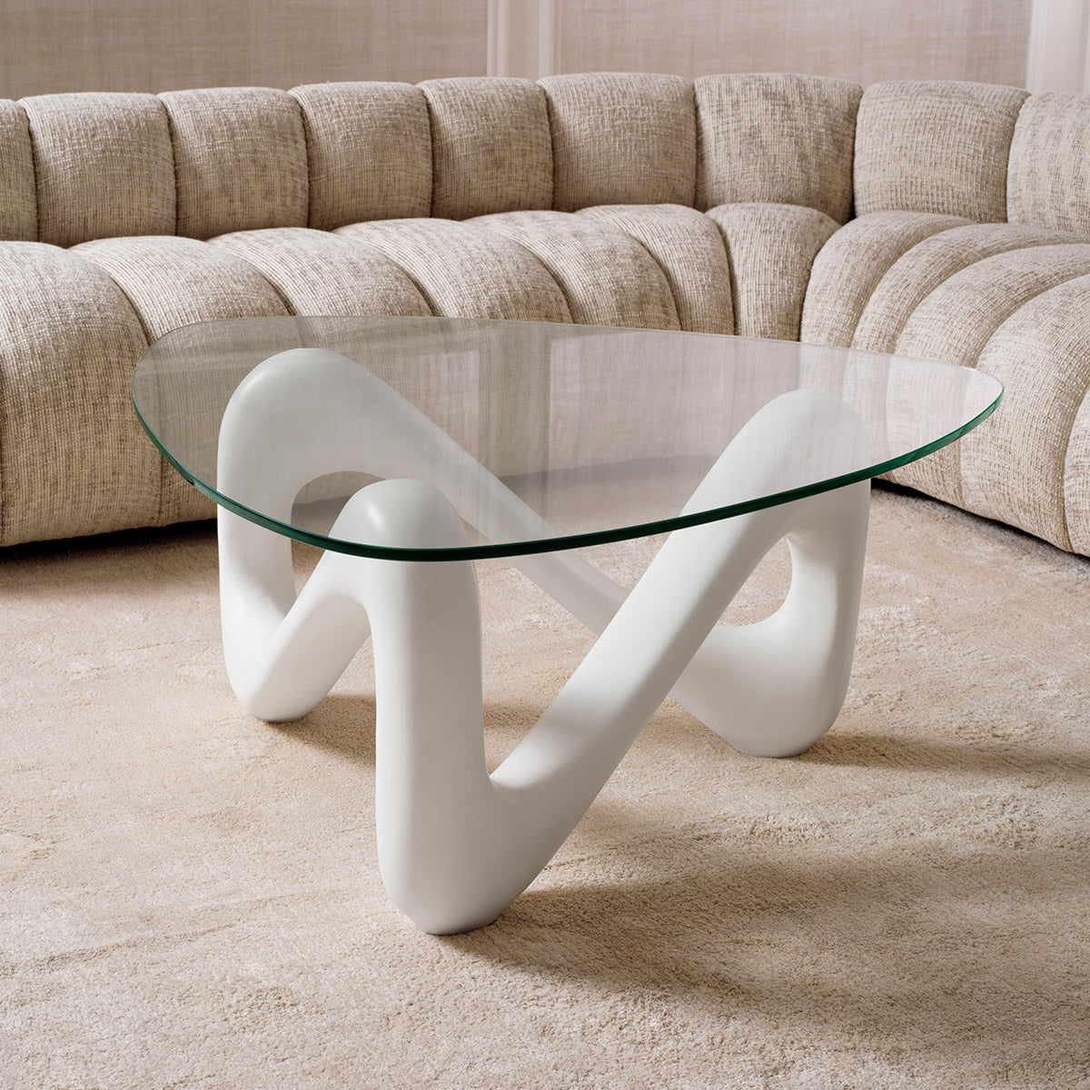 Eichholtz Coffee Table Aventura Fibre Reinforced Concrete, forms a striking base visible through the clear glass top. This modern