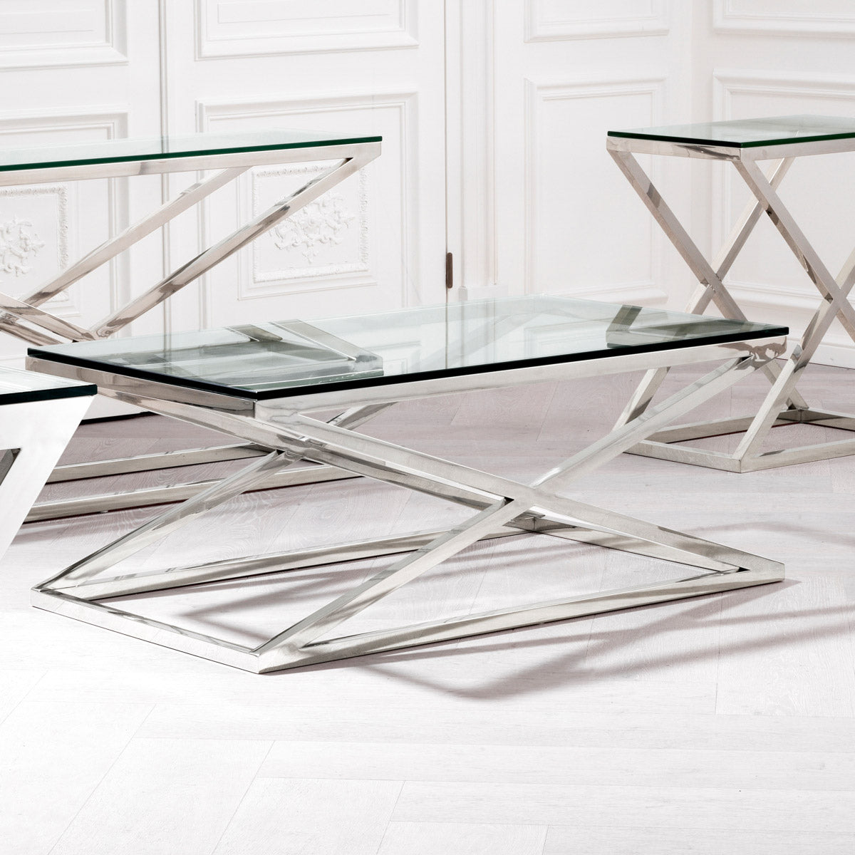 Eichholtz Coffee Table Criss Cross This chic furniture piece comprises a stainless steel frame with a polished finish and comes