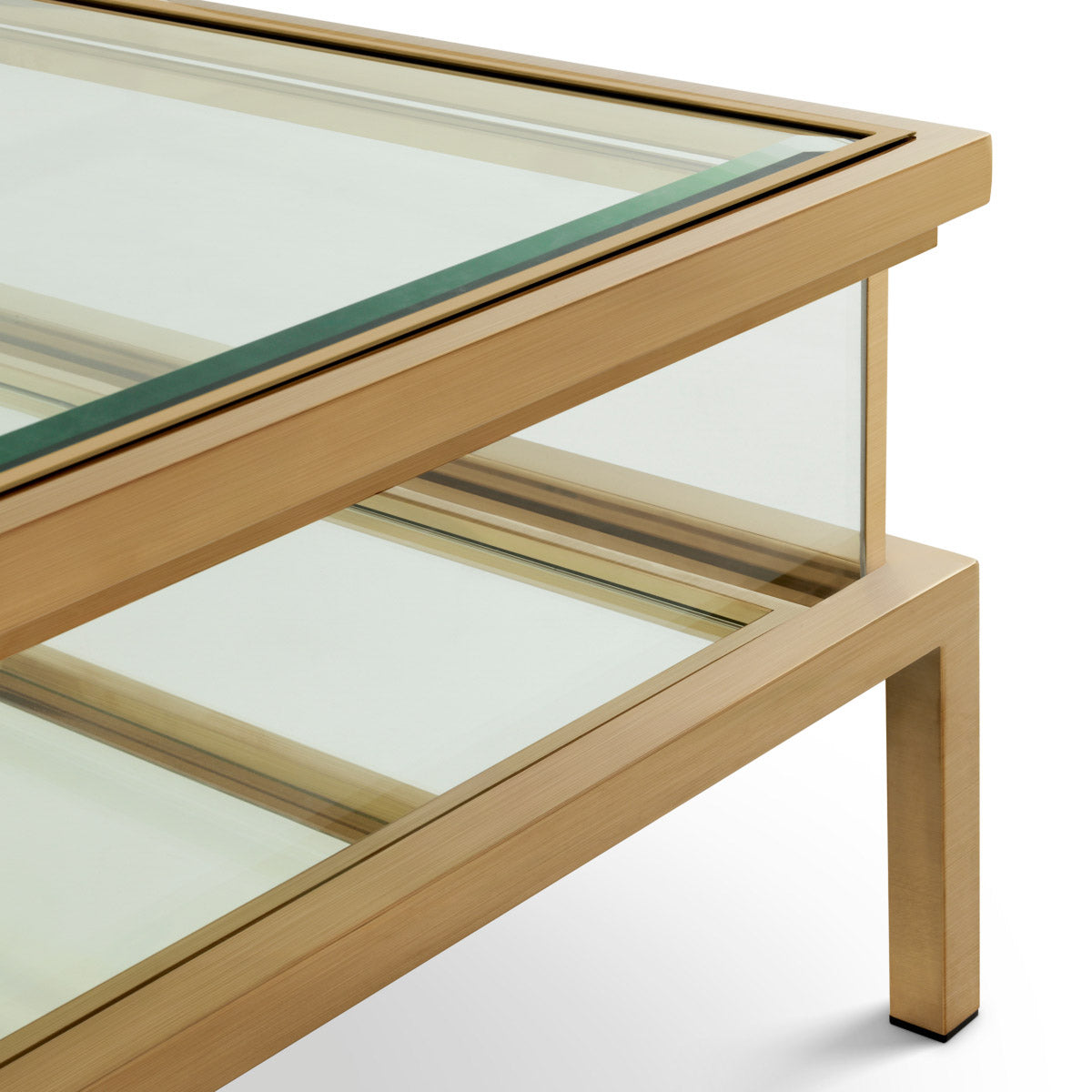 Eichholtz Coffee Table Harvey rectangular showcase decorative items. Comprising a stainless steel frame with a brushed brass finish, it f...