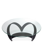 Eichholtz Coffee Table Soquel black veneer wooden frame is artfully visible beneath its clear glass top, harmonizing circular grace